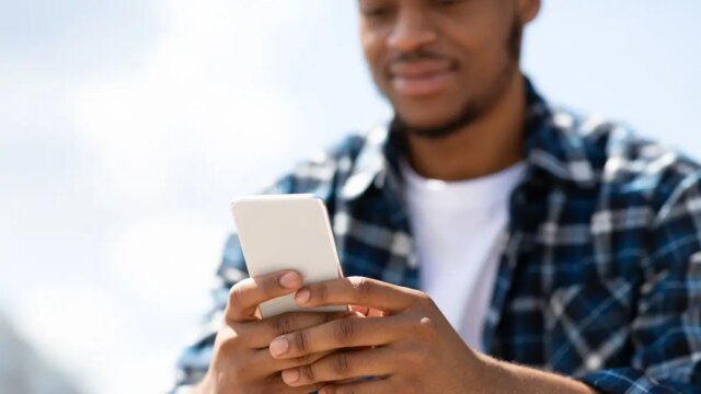 2-MAN-SMILING-AT-PHONE.jpg