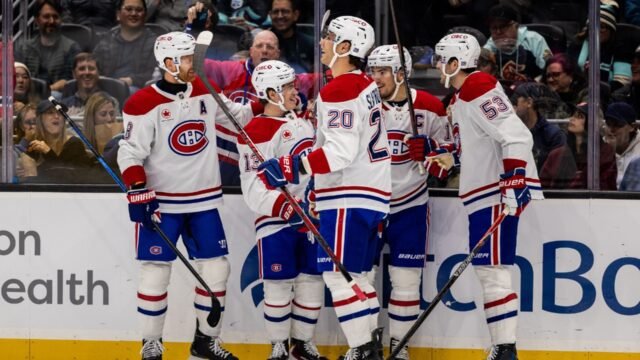 The-Montreal-Canadiens-celebrate-after-a-goal-by-right-wing-Cole-Caufield.jpg