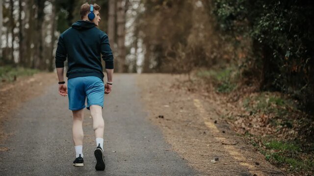 man-walking-looking-over-shoulder.jpg